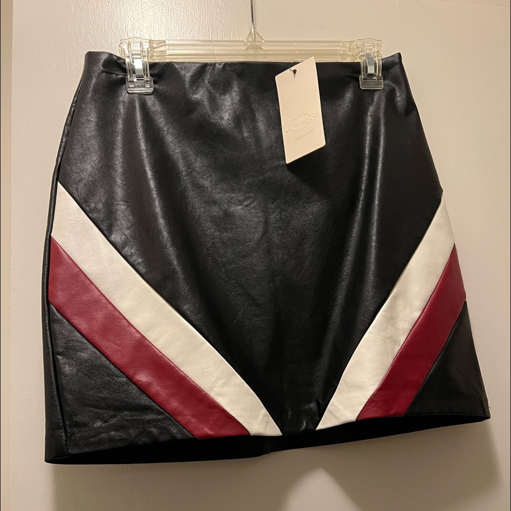 Black leather mini skirt with white and red stripe. Never worn